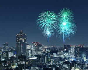 Fireworks celebrating over Tokyo cityscape at night