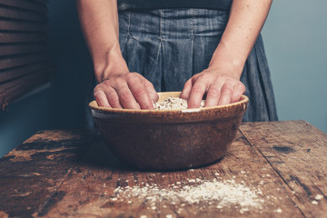 Young woman with oats