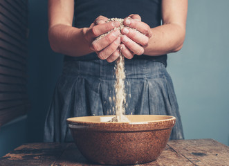 Young woman with oats
