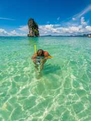 Beautiful woman snorkelling in Krabi Thailand