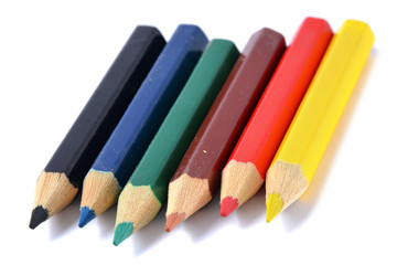 Assortment of colored pencils over white