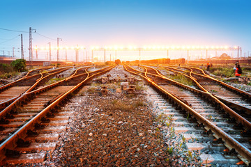 Fototapeta premium Cargo train platform at sunset with container
