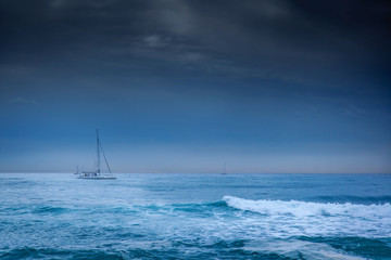 small yacht on a background of cold winter sea