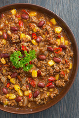 Mexican dish chili con carne, top view close-up