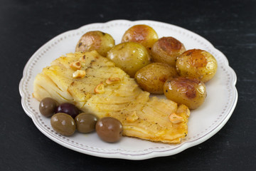 cod fish with potato on plate