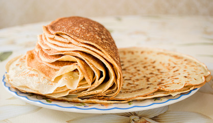 a pile of freshly cooked pancakes on a plate