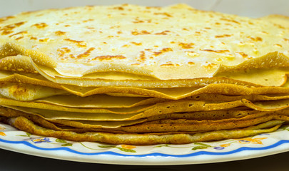 a pile of freshly cooked pancakes on a plate