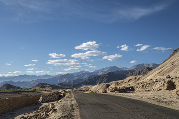 Scenic view of mountain road with majestic mountains backgound