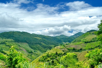 Clouds roll over the volcanic mountaintop during a rainy season