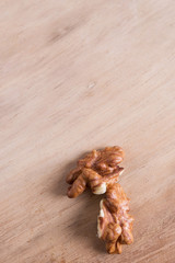 Walnut kernels on wooden background with copy space