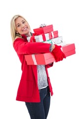 Festive blonde holding many gifts