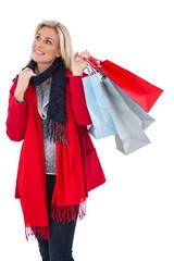 Blonde in winter clothes holding shopping bags