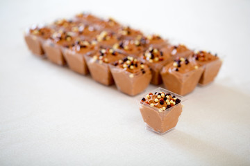 Black chocolate mousse at white table