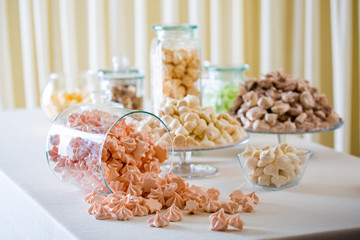 Marshmallow and meringue at white table closeup