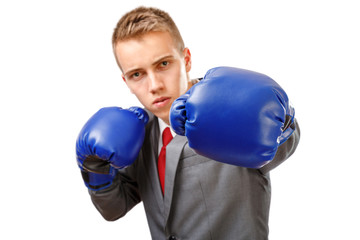 Businessman with boxing gloves punching.