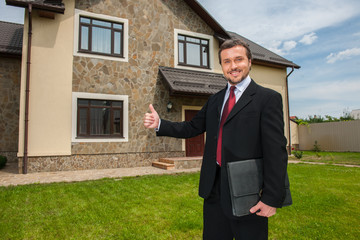 closeup on smiling real estate agent ready to sell house.
