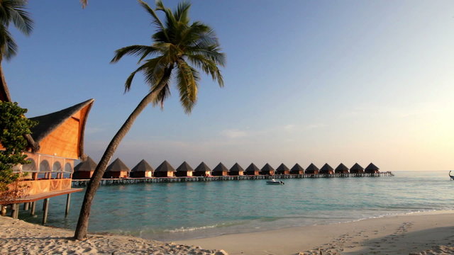 Island in ocean, overwater villas