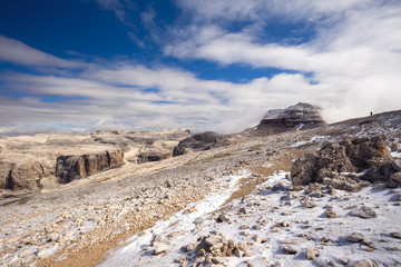 Young man hiking in Sass Pordoi, Dolomiten, Italia, Europe