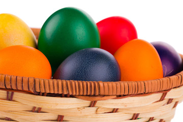 Colorful Easter eggs in basket.