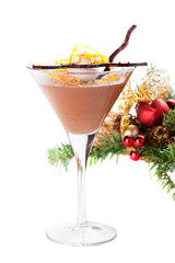 Chocolate orange mousse on a background of Christmas decorations