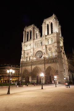 Notre Dame cathedral at night with people