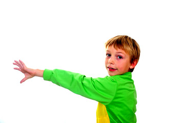 Young boy in studio in green cardigan on white background