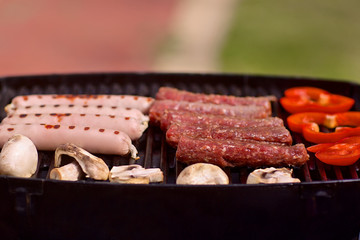 BBQ with sausages, pappers and mushrooms