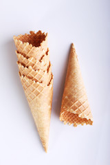 row of ice cream cones on white background