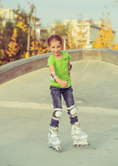 Fototapeta premium Little girl on roller skates