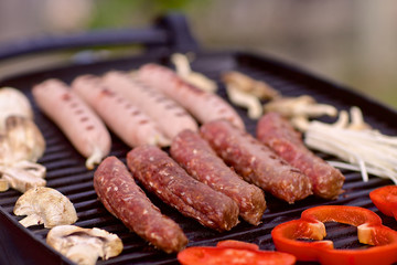 BBQ with sausages, pappers and mushrooms