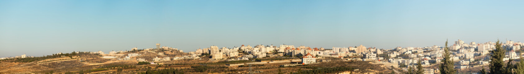 Fototapeta na wymiar Wide panorama of houses on the outskirts of Hebron