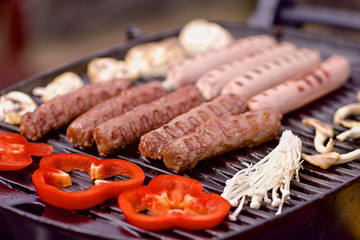 BBQ with sausages, pappers and mushrooms