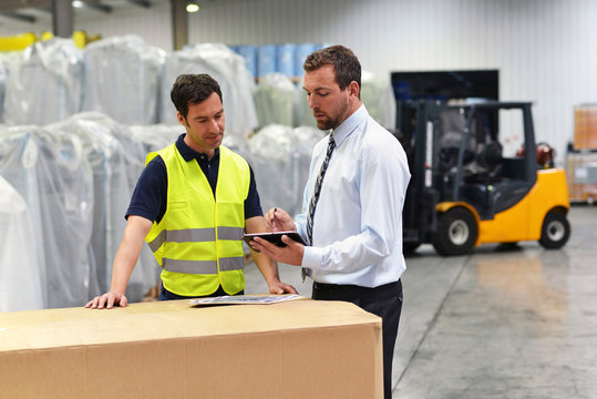 Teamwork - Manager and workmen of a logistics company