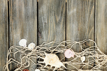 Fototapeta na wymiar Decor of seashells on wooden table background
