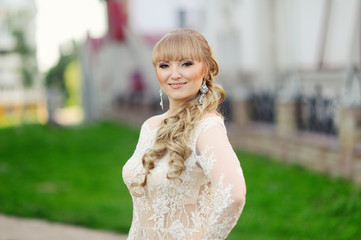 Fototapeta na wymiar Portrait of Beautiful Woman in white Dress