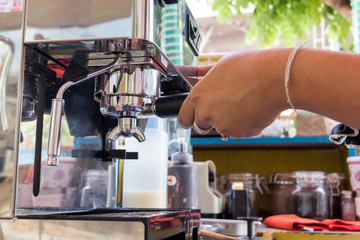 stainless spoon and coffee machine