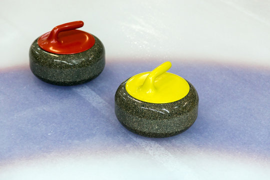Two curling stone on Ice