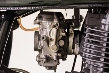 men repair a caburator