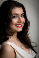 Obraz premium Portrait of a Beautiful Smiling Young Brunette Woman