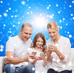 happy family with smartphones