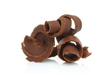 Chocolate shavings on white background .