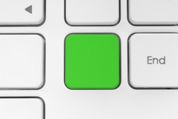 Blank green button on the keyboard close-up.