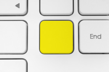 Blank yellow button on the keyboard.