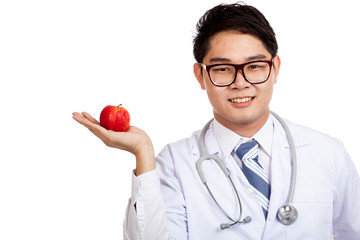 Asian male doctor smile with red apple on palm hand