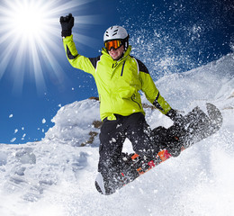 Snowboarder in high mountains