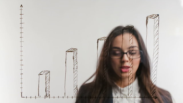 Business woman on background of increasing graph