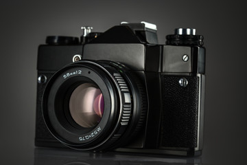 Vintage camera on black background