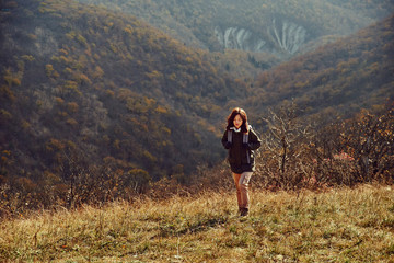 Hiker woman climbing the hill