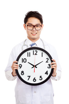 Asian male doctor show a clock