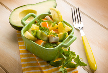 salad with avocado surimi and pineapple